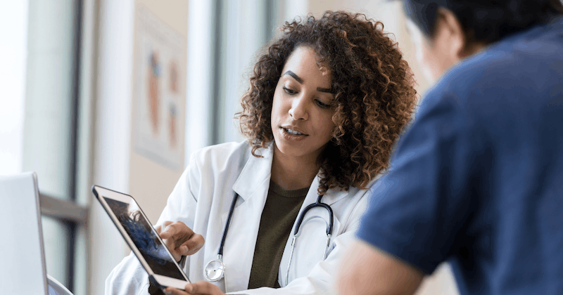 Doctor with tablet